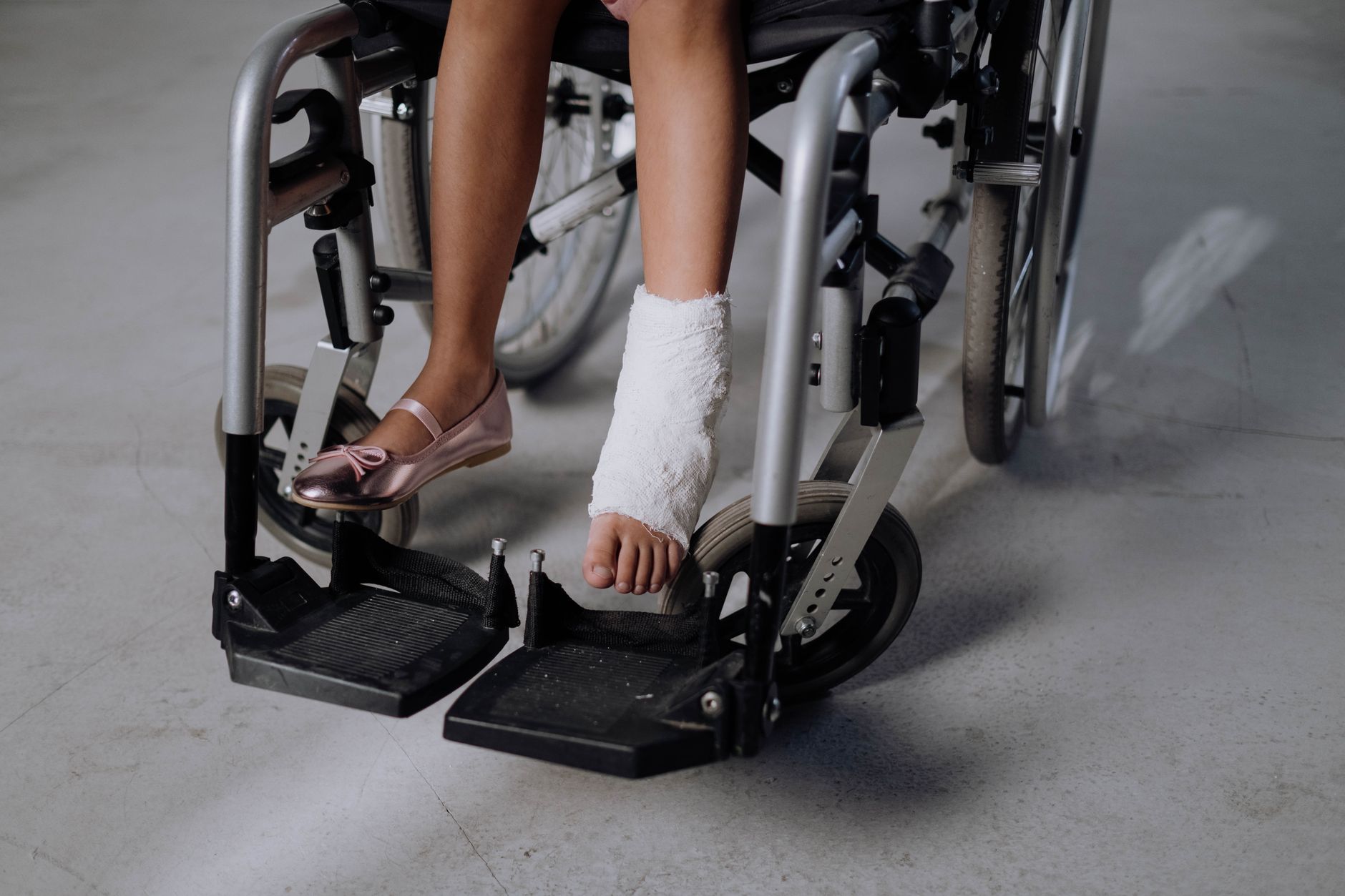 a person who uses a wheelchair looking forward with quiet resolve, catastrophic spinal injury