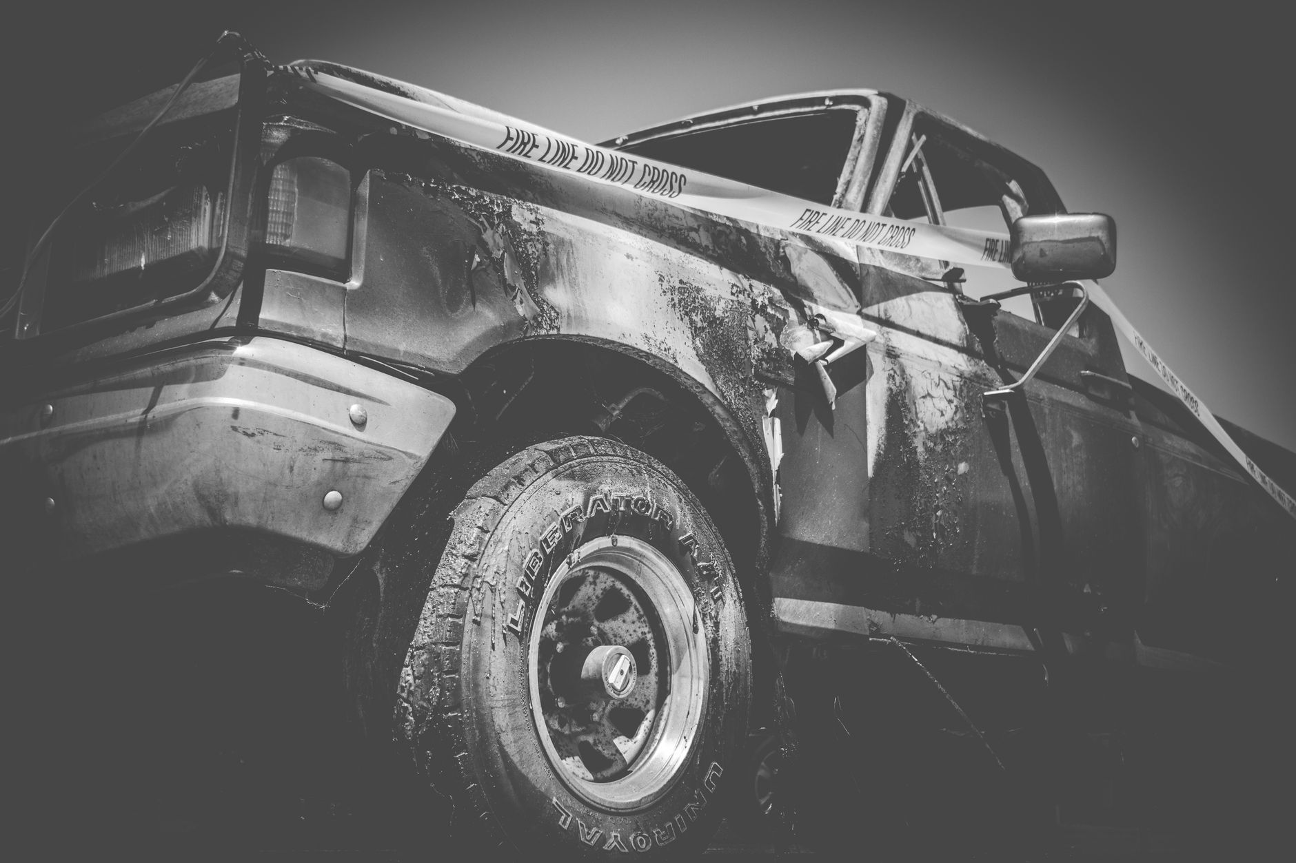 the aftermath of a serious commercial truck collision on a highway at dusk