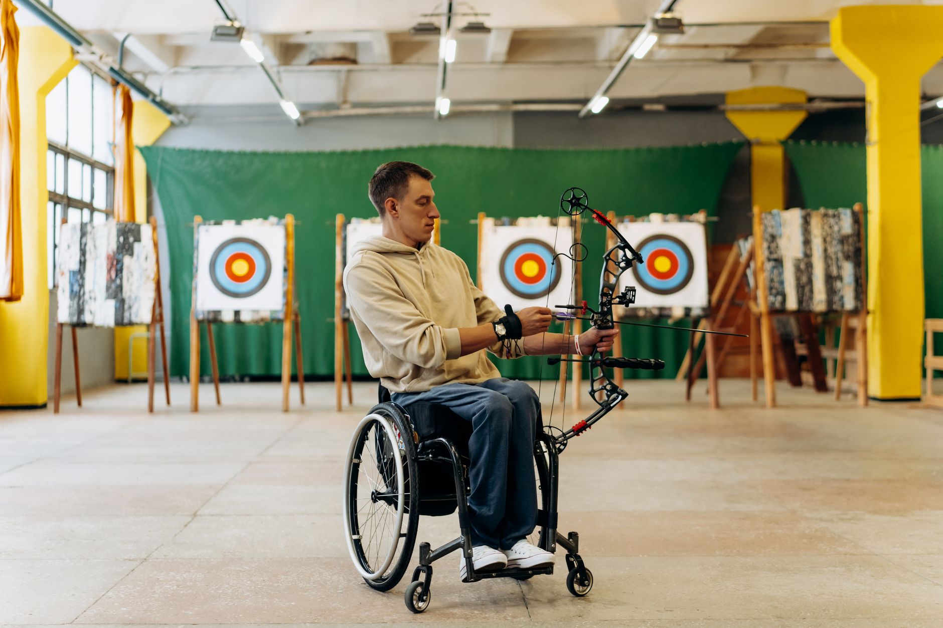 a person who uses a wheelchair looking forward with quiet resolve, catastrophic spinal injury