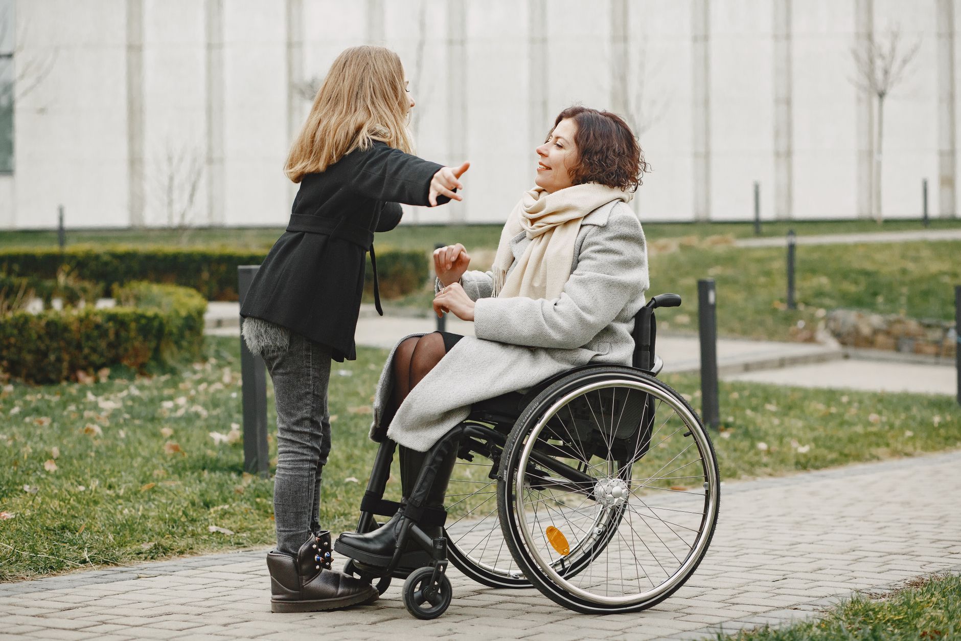 a person who uses a wheelchair looking forward with quiet resolve, catastrophic spinal injury