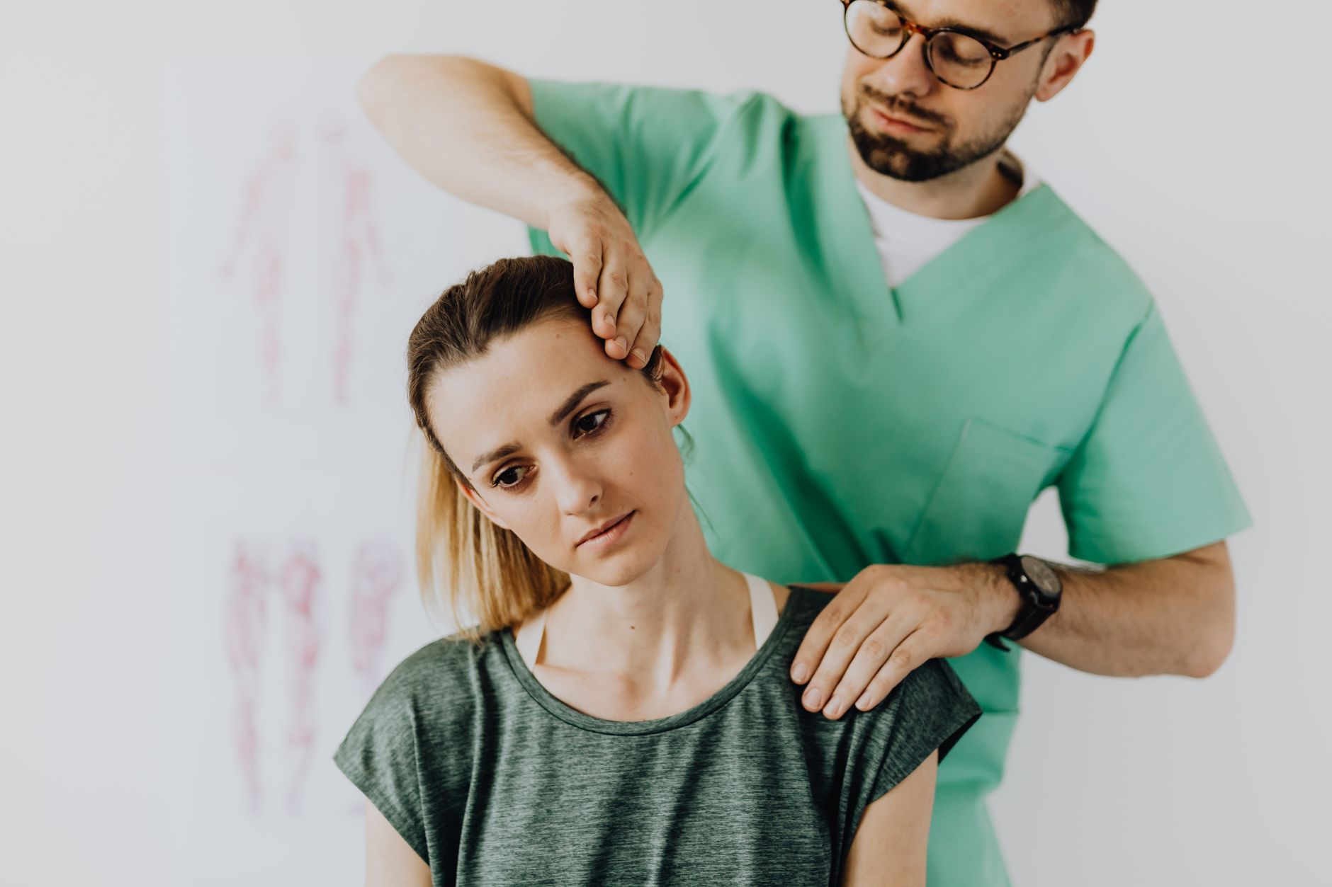 a neurosurgeon reviewing a cervical-spine MRI showing a spinal cord injury
