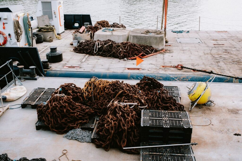 Ship deck chains and maritime equipment in close-up detail.