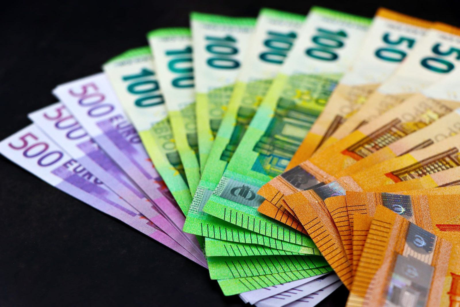 Colorful euro banknotes fanned out representing financial compensation for back injury claims.