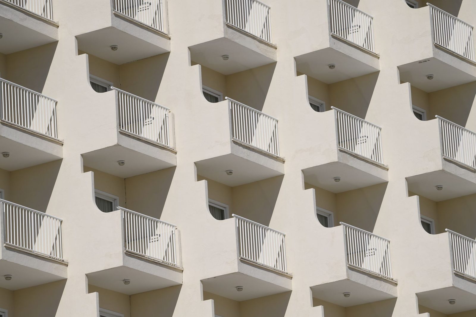 Sunlit balconies on a modern apartment building in the Balearic Islands, Spain.
