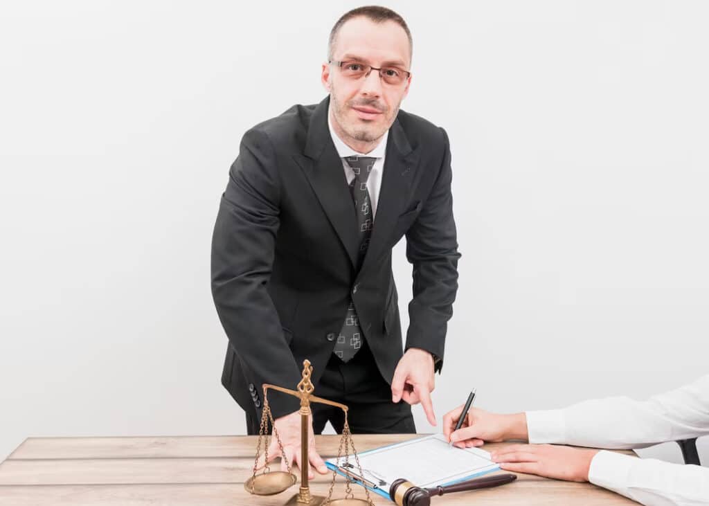 Lawyer pointing to a document on a table