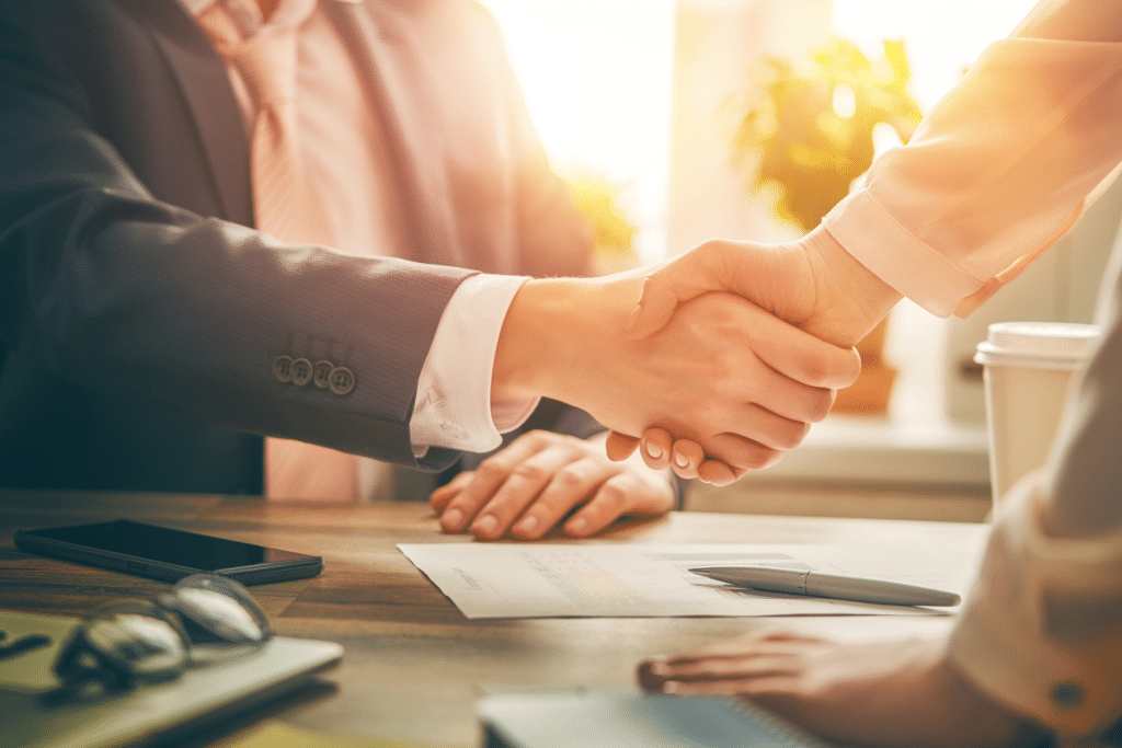Shaking hands to signify maximizing your compensation.