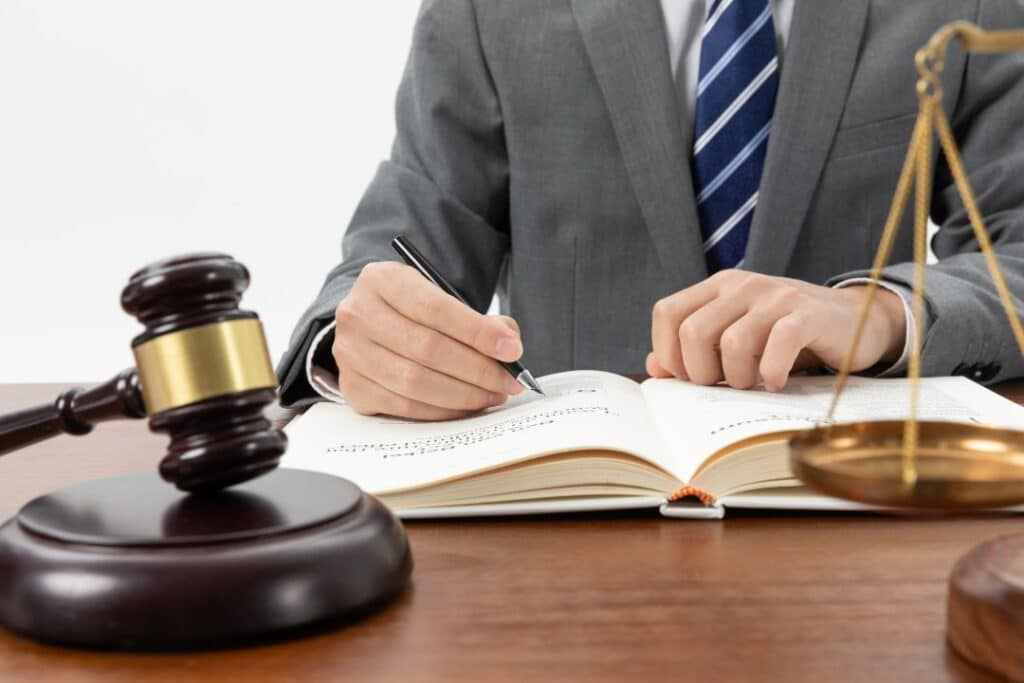 Lawyer working with legal books and gavel