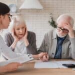 Catastrophic injury claims lawyer consulting with client about insurance denial - CHG Lawyers
